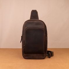 Men's Leather One shoulder bag Crossbody Bag Backpack for men Leather Shoulder Bag Messenger Bag For Men ◾PRODUCT INFORMATION --------------------------------------------- --Product Size:  - 26×16×5 cm  - 10.23×6.29×1.96 in --Item Weight: 0.6 kg/1.32Pounds --High-Quality & Density Stitching On the back of the crossbody bag are two hooks for both the left and right shoulders --FEATURES-- This leather messenger bag exudes an irresistible charm with its unique design and exceptional craftsmanship. Carefully constructed by skilled artisans, this bag embodies the perfect blend of functionality, durability, and minimaliste style. The bag is expertly fashioned from the first-layer cowhide, chosen for its natural beauty and remarkable resilience. Its rich hues and subtle variations in the leather' Functional Brown Rectangular Chest Bag, Brown Satchel Chest Bag For Outdoor, Brown Portable Chest Bag For Outdoor, Outdoor Satchel Chest Bag With Cell Phone Pocket, Brown Portable Backpack For Outdoor, Durable Chest Shoulder Bag, Brown Backpack With Cell Phone Pocket For Outdoor Activities, Rectangular Chest Bag For Outdoor Activities, Durable Chest Bag For Outdoor Activities