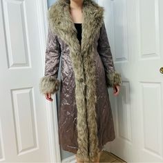 Long Fur Trim Winter Coat Brand: Donna Salyer’s Fabulous Furs Condition: Great Preowned Condition, No Notable Flaws Size: Small Measurements *Taken Across + Laid Flat*: Chest~20in Waist~18.5in Length~45.5in Shoulders~15.5in Sleeve Length~23.5in Style: Long Trench Coat Afghan/Shearling Style Faux Fur Trim Hooks Closed In Front Winter, Whimsigoth, Fairy, Retro, Mob Wife Metallic Gray Color Winter Whimsigoth, Whimsigoth Fairy, Afghan Coat, Fabulous Furs, Mob Wife, Long Trench, Long Trench Coat, Flat Chest, Fur Trim