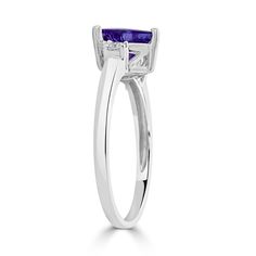 With The Charm Of Trillion Cut Tanzanite And Round Diamonds, This Ring Will Complement All Your Ensembles Effortlessly. Moreover, The Intricate Detailing On 14k White Gold Proves World-class Craftsmanship. Product Information SKU ADG1082/44 Metal Type 14K Metal Color White Gold Ring Style Solitaire Primary Stone Gemstone Name Tanzanite Gemstone Species Zoisite No. Of Gemstones 1 Gemstone Shape Trillion Gemstone Weight 1.08 Gemstone Size 7x7 Origin Tanzania Secondary Stone Gemstone Name Diamond G Formal Tanzanite Trillion Cut Ring, Tanzanite Cushion Cut Ring For Anniversary, Classic Tanzanite Birthstone Promise Ring, Classic Tanzanite Solitaire Ring, Trillion Cut Tanzanite Ring For Anniversary, Tanzanite Trillion Cut Ring For Anniversary, Classic Diamond Solitaire Amethyst Ring, Formal Trillion Cut Birthstone Ring, Classic Solitaire Amethyst Ring With Diamond