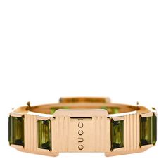 This is an authentic GUCCI 18K Yellow Gold Green Tourmaline 7mm Link to Love Ring size 47 or 4.25.The ring is crafted of 18 karat yellow gold, and features an ornate wide band accented with green tourmaline crystal details. Gucci Designer Rings In 14k Gold, Gucci 14k Gold Designer Rings, Designer Gucci 14k Gold Rings, Gucci Gold Wedding Ring, Gucci Gold Rings For Wedding, Modern Gucci Rings For Anniversary, Luxury Tourmaline Rings, Gucci Gold 14k Gold Rings, Gucci 14k Gold Rings For Formal Occasions