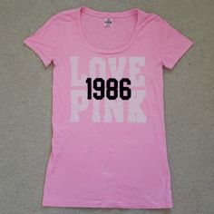 Nwot Victoria's Secret Pink T-Shirt, Fits Close To Body - Not Skin Tight, But Also Not Loose. Only Wore It Once, So Pretty Much New (As You Can See That There Is No Sign Of Wear On The "Love Pink" Lettering). The "1986" Lettering Is In A Black Felt Material That's Slightly Raised Above The "Love Pink" Lettering (I Tried To Capture This In The Third Pic). The T-Shirt Is In A Bright Light Pink. Super Comfortable And Cute! Pink Stretch T-shirt With Text Print, Pink Stretch T-shirt With Letter Print, Stretch Pink T-shirt With Letter Print, Basic Pink Scoop Neck T-shirt, Pink Cotton Scoop Neck T-shirt, Pink Scoop Neck Casual T-shirt, Pink Stretch T-shirt With Scoop Neck, Felt Material, Pink T Shirt