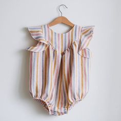 Made from Organic Cotton: An eco-friendly, breathable, and hypoallergenic fabric that’s gentle on delicate skin. Care Instructions: Machine wash on a gentle cycle, tumble dry on low. A Thoughtful Gift: Ideal for birthdays, holidays, or any day you want to make extra special for the little one in your life. Striped Sleeveless Summer Bodysuit, Cute Cotton Sleeveless Bodysuit, Cute Sleeveless Cotton Bodysuit, Multicolor Sleeveless Playwear Bodysuit, Sleeveless Ruffle Bubble Romper For Playdate, Pink Cotton Bodysuit For Beach, Sleeveless Cotton Onesie For Playdate, Playful Sleeveless Bodysuit For Playtime, Sleeveless Cotton Onesie For The Beach