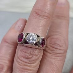 Ring Size 6 Sterling Silver Synthetic Ruby Cubic Zirconia Handmade Jewelry Gift My Dad Hand Made This Unique Piece. Perfect For An Engagement Ring. Comes In A Beautiful Pouch. Beautiful Boho Hippie Festival One Of A Kind Cool Coachella Birthday Gift 90s 80s 70s 60s Resort Bohemian Retro Travel Casual Spring Summer Fall Vacation Johnny Was Gypsy Spell Vici Arnhem Love Lemons Mumu Anthropology Anthro Madewell Free People Faithful Wildfox Zara Reformation Revolve Contemporary Fashion Style Wild Fox Silver Rings With Lab-created Ruby, Dazzling Ruby Ring With Silver Setting, Dazzling Silver Ruby Ring With Brilliant Cut, Red Sterling Silver Jewelry With Brilliant Cut, Silver Three-stone Ruby Ring, Red Diamond Bezel Setting Jewelry, Formal Silver Ruby Ring With Three Stones, Red Diamond Jewelry With Bezel Setting, Silver Ruby Ring With Three Stones