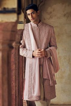 Dusty rose sherwani with tonal dori, beads and crystal embroidery in abstract floral pattern. Paired with matching kurta, churidar and an embroidered border stole. - Aza Fashions Traditional Raw Silk Sherwani With Mirror Work, Pink Sherwani With Mirror Work For Designer Wear, Traditional Pink Sherwani With Intricate Embroidery, Traditional Pink Sherwani With Dupatta, Pink Sherwani With Mirror Work For Festivals, Pink Mirror Work Sherwani For Festivals, Bollywood Style Pink Sherwani With Mirror Work, Elegant Semi-stitched Bandhgala With Dupatta, Pink Bollywood Sherwani With Mirror Work