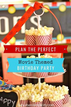 a movie themed birthday party with red and white striped paper cups, popcorn boxes, and a sign that says plan the perfect movie themed birthday party