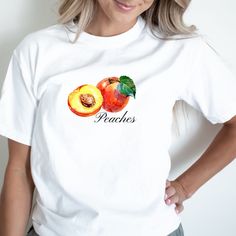 Peach Trendy Crewneck Cottagecore Shirt Graphic Tees For Women Fruit tshirt Comfort Colors Gift for Foodie Trending Fruit Shirt Please message us if you want your t-shirt in one of the additional colors or a sweatshirt.  Comfort Colors garment-dyed t-shirt made 100% with ring-spun cotton. The soft-washed, garment-dyed fabric brings extra coziness to your wardrobe while the relaxed fit makes it an excellent daily choice.  Please keep in mind that the design is scaled down for smaller t-shirt sizes. T-SHIRT CARE INSTRUCTIONS: Machine wash cold Wash inside-out, with similar colors Tumble dry low. Hang-dry for longer life Cool iron inside-out. Do not use bleach Do not iron directly on the print Do not dry-clean Thank you for supporting our small business! Please visit our shop https://www.etsy Fruit Baby, Fruit Shirt, Minimalist Shirt, Trendy Crewneck, Peach Shirt, Cottagecore Shirt, Minimalist Shirts, Cute Gifts For Her, Peach Fruit