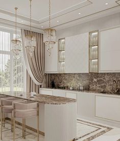 an elegant kitchen with marble counter tops and white cabinets, along with gold trimmings