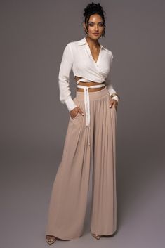 The Beige After Sunset Pleated Pants will become an instant staple in your wardrobe! Crafted from lightweight fabric, this lovely pair of trousers feature beautiful pleating throughout with a high waistband and stylish wide leg hems. Complete with functional side pockets and a hidden back zipper. Pair with our Want It All Crochet Bustier or Drift Away Linen Wrap Top for the full look. Lined interior. Minimal stretch. Materials: 100% Rayon (lining) 95% Rayon 5% SpandexLength: (inseam)31 in. (wais Crochet Bustier, Wide Leg Trousers Black, Linen Wrap Top, Interior Minimal, Strapless Sweetheart Neckline, Draped Top, Mini Robes, Crochet Fabric, Designer Drapes