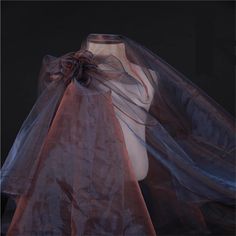 a mannequin is covered with sheer fabric