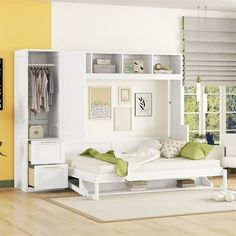 a bedroom with yellow walls and white furniture