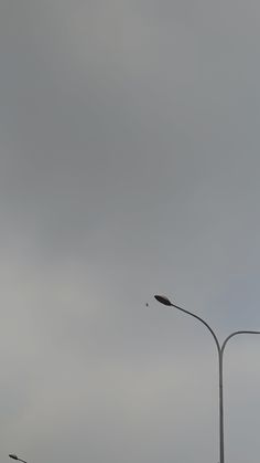 an empty street light on a cloudy day