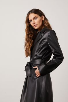 The versatile vegan leather trench coat that is simultaneously timeless with modern besom pockets and belted closure. The Freya has the ‘it-girl‘ stamp of approval. 100% Vegan Leather Leather Trench Coat Dress, Luxury Allsaints Leather Jacket For Fall, Black Leather Dress Classy Coat, Fitted Luxury Leather Jacket By Allsaints, Stamp Of Approval, Long Leather Coat, Faux Leather Coat, Leather Trench, Fashion Magazines