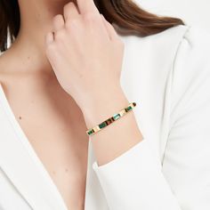 Introducing the Edith Bangle, an iconic piece crafted for everyday elegance. The bracelet features multiple dainty, minimalist design of green cubic zirconia, adding a classic touch to your look. Guaranteed to catch anyone's eye! ………………………………….D E T A I L S• Materials: Stainless steel, 18k gold plating.• Diameter: 2.5 inches (6.2 cm)• This product is hypoallergenic, water and tarnish resistant Contemporary Fine Jewelry, Eye D, Everyday Elegance, Minimal Jewelry, Every Girl, Jewelry Branding, Gold Plating, Jewelry Care, Minimalist Design