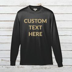 Add Your Own Text - Custom Personalized Wicking T-Shirt Polyester Long Sleeve Tee for Men Put any text you want onto a long sleeve polyester wicking tee shirt with the text color of your choice. Please make sure to look through all the photos for the options we have available. Make sure to include your custom options in the Add Your Personalization section before adding the item to your cart. - 100% polyester wicking knit - Self-fabric collar, double-needle cover-stitched collar and armholes - S Customizable Long Sleeve Sports T-shirt, Custom Text Long Sleeve Tops For Streetwear, Customizable Black Long Sleeve T-shirt, Customizable Black Top With Text, Customizable Black Long Sleeve Tops, Black Customizable Long Sleeve T-shirt, Black Long Sleeve T-shirt With Custom Text, Black Crew Neck Top With Custom Text, Fabric Collars