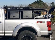 a white pick up truck parked in a parking lot