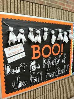 a sign that says boo don't be afraid of the fall festival