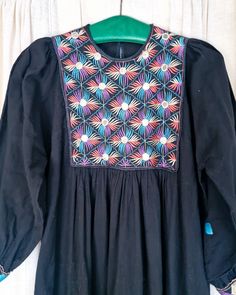 Very nice black cotton dress from India with embroidery and mirrors. Some mirrors have some discolouration due to their age. Sizes measured single and flat: Armpit 53cm Length 118cm The label says size M. Could also fit a size S (slightly looser) or perhaps a small L, but measure it to be sure Long Sleeve Cotton Dress With Mirror Work, Cotton Long Sleeve Dress With Mirror Work, Black Cotton Folk Embroidered Dress, Black Bohemian Embroidered Dress With Geometric Pattern, Cotton Dresses With Mirror Work For Festivals, Black Folk Style Cotton Dress, Bohemian Cotton Dress With Mirror Work, Black Cotton Folk Dress, Folk Style Black Dress For Festivals