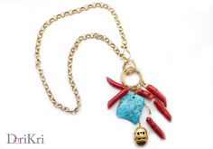 Golden charm necklace with Corals and turquoise gemstone -  Golden necklace, red blue - Red charms coral turquoise pendant - Statement necklace - Very peculiar necklace - Corals - turquoise - Golden charm -  This is an unordinary necklace featuring real natural corals and a beautiful turquoise gemstone. It is a casual but elegant necklace.  Marine themed necklace.  This necklace is made using a golden 67cm (26,37'') long, 1cm (0,39'') chunky round ringed chain.  The closure is lateral to the pen Red Charms Necklace With Round Pendant, Red Charms Round Pendant Necklace, Red Necklace With Charms And Round Pendant, Red Necklace With Round Pendant And Charms, Turquoise Charm Necklace With Lobster Clasp As Gift, Turquoise Necklace With Detachable Pendant, Turquoise Pendant Necklace With Detachable Pendant, Gold Turquoise Necklace With Lobster Clasp, Gift, Unique Red Jewelry With Charms