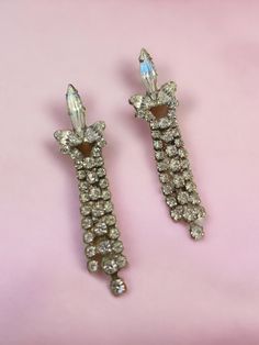 Vintage 1950s - 1960s Clear Rhinestone Dangle / Drop Earrings with Post Backing for pierced ears  Measures Approx.  1 1/2" in length  1" width at Post Back Wonderful Sparkle and Movement on these MCM Costume Jewels. Vintage Dangle Chandelier Earrings For Anniversary, Vintage Chandelier Dangle Earrings For Anniversary, Vintage Dangle Earrings For Evening, Vintage Chandelier Earrings For Anniversary, Vintage Crystal Drop Earrings For Pierced Ears, Vintage Crystal Drop Earrings For Anniversary, Vintage Dangle Chandelier Earrings, Vintage Crystal Clip-on Earrings For Formal Occasions, Vintage Earrings With Sparkling Stones