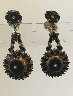 "A statement pair of long victorian gold and mainly gold-filled, ornate post pierced earrings.  It has become difficult to find these statement victorian larger drop earrings.  Condition for their age is good, they have had the post replaced, there have been old repairs-the wings for the pots are large and marked 14kt 1/20 gold filled.  Length-1 3/4\".  THE unusual paisley black jet jewels are abundant and bezel set. The majority of the metal is rolled gold or gold-filled, the carved black flowe Victorian Screw Back Earrings For Formal Occasions, Victorian Gold Plug Earrings, Antique Evening Earrings For Pierced Ears, Victorian Earrings For Evening, Victorian Pierced Earrings For Evening, Victorian Chandelier Drop Earrings With Intricate Design, Antique Chandelier Earrings For Formal Occasions, Victorian Earrings For Evening Occasions, Ornate Evening Earrings With Intricate Design