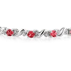 This beautiful 10k white gold diamond bracelet features 14 oval cut  ruby gemstones. 28 round prong set diamonds weigh 0.15ctw, color J-K-L, clarity I2-I3. ruby gemstones measure 4x3mm and weigh 2.75ctw. Red Round Bracelets With Diamond Accents, Red Bracelets With Diamond Accents, Red Diamond Accents Bracelet For Anniversary, Red Diamond Accents Bracelets For Anniversary, Red Diamond Accent Bracelets For Anniversary, Red Bracelets With Diamond Accents For Anniversary, White Gold Diamond Bracelet, Gold Diamond Bracelet, Ruby Bracelet