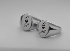 Our personalized silver signet ring set can be custom engraved for your engagement, promise rings or wedding bands. A personalized ring is a sentiment of love that can be inscribed with names, dates or a custom message. Personalized Signet Ring Set Finish: High Polish Stainless Steel Sizes available: 5-6-7-8-9-10-11-12-13-14-15 IMPORTANT: Don't guess - find out how to accurately measure your ring size The most accurate way to determine your ring size is to visit a local jewelry store where they Oval Stainless Steel Signet Ring For Gift, Oval Stainless Steel Signet Ring As Gift, Personalized Black Engraved Ring For Anniversary, Classic Stainless Steel Signet Ring As Gift, Classic Stainless Steel Signet Ring Gift, Stainless Steel Engraved Ring With Polished Finish For Promise, Classic Personalized Stainless Steel Rings, Stainless Steel Polished Engraved Promise Ring, Stainless Steel Oval Rings For Gifts