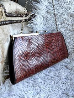 This listing is for a very nice vintage  leather bag in  vintage condition with gold tone clasp  ,  this bag is in excellent vintage condition  , could be used without any problem Quantity : 1    Dimensions : 30cm x 13cm x 2.4cm ,   40cm chain,    /   12" x 5.2" x 1"   Material of item : leather  Thank you very much for your visit , your mail will be sent by simple mail from France within 3 business days (if you need a registered mail please contact me in advance) , All mail take about 20 days t Vintage Rectangular Leather Evening Bag, Vintage Leather Rectangular Evening Bag, Vintage Formal Bags With Gold Clasp, Vintage Brown Rectangular Evening Bag, Vintage Brown Evening Bag For Party, Vintage Clutch With Gold-tone Hardware, Vintage Clutch With Gold-tone Hardware For Everyday Use, Vintage Evening Shoulder Bag In Vintage Brown, Vintage Red Bags For Formal Occasions