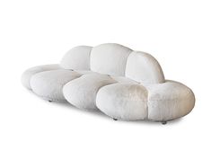 a white couch that is shaped like a caterpillar