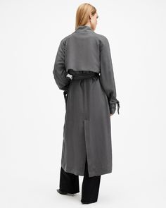 Lightweight and long - make the Koko your go-to layer this season. Crafted from a fluid fabric and shaped to an oversized, double breasted silhouette with a self-tie waist belt. Topstitching and a stepped collar are the final details - take it from season to season.  This coat is designed to an oversized fit, we recommend sizing down for a closer fit Button closure Stepped collar Long sleeves Double breasted Self-tie belt Two front welt pockets Bound seams Curved back storm flap Oversized Trench, Oversized Trench Coat, Short Trench Coat, Blue Trench Coat, Grey Coat, Trench Coat Black, Curved Back, Leather Trench Coat, Trench Coats Women