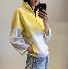 Beautiful example of 80s design. The design is the mixture of 3/4 sleeve Light sweatshirt and T-shirt. White and yellow cotton mix fabric. Pockets. Press stud closing. Size 36. The model on the photos is 174 cm tall, bust 86 cm, waist 66 cm and hips 89 cm. Yellow Long Sleeve Cotton Sweatshirt, Yellow Cotton Long Sleeve Sweatshirt, Oversized Yellow Sweatshirt For Spring, Oversized Yellow Spring Sweatshirt, Trendy Yellow Cotton Sweatshirt, Yellow Relaxed Fit Cotton Sweater, Relaxed Fit Yellow Sweatshirt For Spring, Retro Mustard Long Sleeve Tops, Mustard Retro Long Sleeve Tops