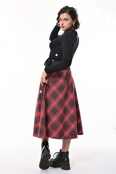 Tale: Pull on our limited edition Bonnie Midi Skirt for a day of adventure. Made from a soft polyester and wool blend, this is the perfect skirt for Autumn/Winter! The side pockets are a must in our busy lives and these can truly fit your phone as well as other essentials. The Gorgeous stretchy deep waistband cinches in your waist but feels comfortable against you skin for ultimate comfort. Wear with tights and boots for the perfect cozy look. Our model is 5ft 7" and wears an S with our Kenza Wrap. Please see our size guide. 95% Polyester 5% Wool skirt, 95% Cotton 5% Elastane rib waistband Made in Britain Polyester Wool Limited Edition Wash at 30* Warm Tumble Dry Warm Iron Do Not Bleach Do Not Dry Clean Small Frocks, Stocking Fillers For Her, Tights And Boots, Red Tartan, Wool Skirt, Fall Skirts, Comfort Wear, Wool Skirts, Independent Designers Fashion