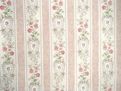 an old wallpaper with pink flowers and green leaves on white stripes in the background