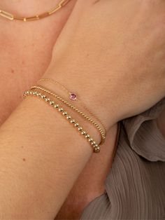 Birthstone jewelry makes for an extra special birthday gift! This bracelet is an unforgettable gift and a beautiful piece for anyone who loves their birthstone! Luxury Adjustable Birthstone Bracelets, 14k Yellow Gold Rondelle Bracelets, Elegant Stackable Rose Gold Tennis Bracelet, Elegant 14k Pink Gold Bracelets, Stackable Rondelle Jewelry For Gift, Elegant Gold Name Bracelet With Round Beads, Elegant Adjustable Name Bracelet With Round Beads, Yellow Gold Bracelet With Round Beads For Gift, Yellow Gold Bracelets With Round Beads For Gifts