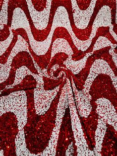 Stretch Velvet Sequins This beautiful design is a stretch velvet fabric that has sequins embroidered throughout the whole fabric. This fabric is ideal for decorative and apparel purposes. The width of the velvet fabric is 60" and the sequins are embroidered at 58"/ 60". Item is sold by the yard. If more than one yard is purchased, item will come in one piece. Details 5mm Sequins2 - Way Stretch Width: Stretch Velvet 58"/60"Content: 85% Polyester Please Note: *The digital images we display have th Red Fitted Embroidered Fabric For Party, Fitted Red Embroidered Fabric For Party, Festive Red Embroidered Party Fabric, Festive Red Embroidered Fabric For Party, Festive Red Sequin Fabric, Red Sequined Embroidered Fabric For Party, Red Embroidered Fabric With Sequins For Party, Red Embellished Sequin Fabric For Festive Occasions, Festive Red Embellished Sequin Fabric