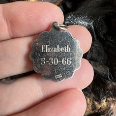 Vintage Charm for a BraceletSmall sterling silver special delivery stork dangle style charm. The reverse has the name Elizabeth and the birth date 5-30-66 on it. I have not polished the charm as you may like the silver patina and I wanted you to be able to decide the finish. Weighs 2.8 gramsDiameter 21.8 mmPlease note that color may vary a small amount because of my lighting. If you have questions please ask and I would be happy to help! -Michelle Silver Personalized Spiritual Charms, Personalized Spiritual Silver Charms, Personalized Engraved Silver Charms, Engraved Silver Charms For Customizable Gifts, Collectible Silver Engraved Charms, Personalized Sterling Silver Medallion, Silver Engraved Charms For Collectors, Engraved Pendant Charms For Anniversary, Silver Engraved Charms For Mother's Day