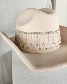 Stand out from the herd with our Glam Cowgirl Hat, featuring rhinestone fringe for a touch of bling. Perfect for rodeos, festivals, country concerts, or just everyday wear. Don't be a plain Jane, grab your glam cowgirl hat today! Western Hats With Bling For Rodeo, Western Bling Hat For Rodeo, Western Style Bling Hats For Rodeo, Brimmed Hats With Rhinestones For Country Events, Country Style Rhinestone Hats For Rodeo, Festival Fedora Hats With Rhinestones, Western Style Adjustable Hat With Rhinestone Fringe, Adjustable Rhinestone Hat Bands For Western-themed Events, Western Wide Brim Hat With Bling