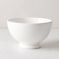 a white bowl sitting on top of a table