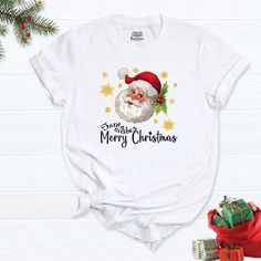 "Santa Claus Shirt, Christmas Shirt, Merry Shirt, Christmas t-shirt, Christmas Gift Shirt, Papa Claus Christmas Tee, Christmas Family Shirt. HI! Welcome to my store, I'm delighted to see you here. My store's main goal is to provide you with premium everyday apparel with the best graphic t-shirts. I see you as a friend, not just a customer. I'm sure you'll love my designs. So, here is a brief description for you to-see-the order-process: 1. Please, Check and Review all Photos. 2. Select Your T-Sh Christmas Holiday T-shirt With Letter Print, Christmas Holiday Letter Print T-shirt, Christmas Holiday T-shirt With Short Sleeves, Christmas Crew Neck Shirt Gift, Christmas Graphic Tee Shirt For Holiday, Christmas Gift Crew Neck Shirt, White Christmas T-shirt Gift, Christmas Holiday Short Sleeve T-shirt, White Christmas Festive T-shirt