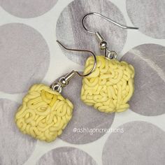 Ramen Earrings Noodles measure approximately between 1.5cm to 2.25cm Materials: ▫ Polymer Clay ▫ Hypoallergenic Hanging Earring Hook Each Ramen square is handmade by me, so you may receive a pair of earrings that are slightly different from the ones pictured in the listing. As they are all made by hand all are similar but no two pairs will ever be the same! I can also do custom orders. Please feel free to send me a message with any questions or ideas! Thanks for checking out my shop! Handmade Yellow Rectangular Jewelry, Handmade Yellow Plug Earrings As Gift, Handmade Square Earrings For Gift, Handmade Yellow Rectangular Earrings, Yellow Rectangular Earrings As A Gift, Yellow Rectangular Earrings For Gifts, Yellow Rectangular Earrings Gift, Rectangular Yellow Earrings For Gift, Gift Square Pendant Earrings For Pierced Ears