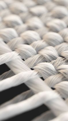 closeup of white woven material with black background