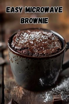 a chocolate mug cake is sitting on a table with the words easy microwave brownie