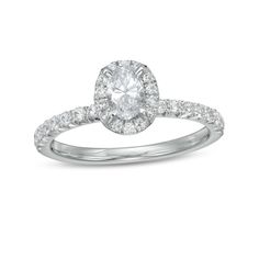 She'll love the classic look of this stunning diamond engagement ring. Created in 14K white gold, this choice showcases a 1/2 ct. oval-shaped diamond wrapped in a diamond halo. Underneath, diamonds glisten along the setting and shank. Radiant with 1 ct. t.w. of diamonds and a brilliant buffed luster, this engagement ring complements her unique style - today and always. Timeless Oval Diamond Ring For Proposal, Timeless Oval Diamond Proposal Ring, Oval Diamond Halo Ring For Formal Occasions, Oval Halo Diamond Ring For Formal Occasions, Timeless Oval Diamond Anniversary Ring, Formal Oval Diamond Ring With Halo Design, Classic Oval Halo Ring For Formal Occasions, Oval Halo Ring With Diamond Accents And Moissanite, White Oval Diamond Ring With Halo Design