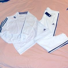 Adidas Triple Stripe Track Suit White With Black Stripes Pants Nwt Size Large Shirt Size Medium Has A Small Spot On Back Under The Arm Excellent Preowned Condition Bv103 White Cotton Athleisure Sets, White Athleisure Loungewear Sets, White Long Sleeve Athleisure Sets, White Long-sleeved Athleisure Set, Sporty White Long Sleeve Set, White Fitted Casual Tracksuit, White Fitted Athleisure Set, Fitted White Athleisure Set, Adidas White Long Sleeve Set