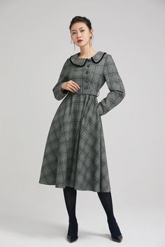 "Simple. With its pleated skirt and grayscale plaid pattern, this vintage wool dress epitomizes classic styling. She's all class and quality with no bells or whistles. Near-perfect vintage condition, designed with lapel collar, long sleeves and tie belt waist, it will be your favorite one of your wardrobe. Details: * 35% wool blend, 35% fiber and polyester, 30% nylon * Polyester lining * long sleeves * tie belt waist * lapel collar * button decoration in front * knee length * back zipper closure Classic Long Sleeve Tweed Dress For Winter, Elegant Plaid Midi Dress For Fall, Vintage Plaid Winter Dress, Vintage Plaid Dress For Winter, Elegant Long Sleeve Plaid Dress For Work, Classic Vintage Dress For Work In Fall, Classic Vintage Dress For Fall Workwear, Elegant Midi-length Plaid Dress For Fall, Classic Plaid Dress For Work In Fall