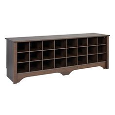 a large wooden shelf with many compartments on the top and bottom, in dark brown