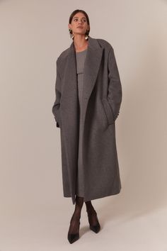 An everyday, winter wardrobe icon. Designed to endure, the Classic Oversized Coat features a timeless design in a premium wool blend for luxury and warmth. Finding confidence in minimalism, it has a modern oversized shape with side pocket details and a double button front closure.  SIZING: Oversized fit. Model wears a size S/M  FABRICATION: Main: 85% nylon, 15% elastane  - Oversized shape - Longline - Front button closures Finding Confidence, Early Fall Fashion, Corsets Fashion, Long Grey Coat, Elegant Outfit Classy, Day To Night Dresses, White Cocktail Dress, Essential Dress, Grey Outfit