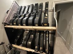 a rack full of guitar cases in a room