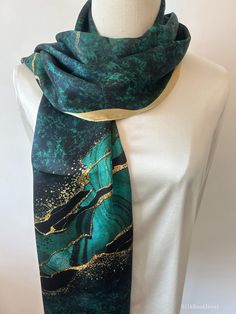 Vibrant and colorful natural mulberry silk long scarf with customized size of 170 cm x 55 cm / 68 in x 22 in. Gorgeous, velvety turquoise print, embellished with dreamy golden-copper streaks. One sided print, smooth and lustrous silk charmeuse, breathable and skin-friendly fabric feels very comfortable to wear. Can style this long scarf in different ways: wear the scarf as a neck scarf, as a long hair scarf, as a head wrap scarf, as an evening cover up...or style it any way you want with your own sense of creativity! Suitable for all seasons and a lovely gift idea for special occasions. Care Instructions: Delicate silk material, avoid washing often. Gently hand wash cold/lukewarm with mild detergent. Do not use alkali. Natural air dry. Dry clean recommended. Low heat iron acceptable. Store Green Silk Scarf For Party, Gold Silk Scarf Shawl For Gift, Elegant Gold Silk Scarf For Festive Occasions, Rectangular Silk Scarf For Gifts, Rectangular Silk Scarf, Perfect For Gifts, Rectangular Silk Scarf, Perfect As A Gift, Rectangular Silk Scarf For Gift, Elegant Green Silk Shawl Scarf, Elegant Green Silk Shawl