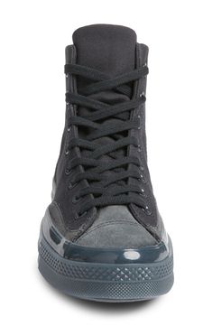 Translucent foxing tape traces the midsole of this suede-trimmed high-top sneaker, offering an elevated take on a closet-staple icon. Lace-up style Cushioned footbed with arch support Textile and leather upper/textile lining/rubber sole Imported Converse High-top Boots For Streetwear, Streetwear Low-top Boots With Rubber Toe Cap, Low-top Boots With Rubber Toe Cap For Streetwear, Canvas High-top Sneakers With Studded Outsoles, Converse Boots With Rubber Sole For Streetwear, Converse Boots For Streetwear With Rubber Sole, Outdoor High-top Sneakers With Translucent Outsole, Converse High-top Sneakers With Rubber Toe Cap, Urban High-top Lace-up Sneakers With Rubber Toe Cap