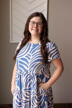 This Blue Boho Tiered Maxi Dress is perfect for a happy and simple summer look. The light weight material will keep you comfortable while the flowy tiered design adds a touch of feminine chic. Plus, it has pockets for added convenience! The Fit of This Boutique Maxi Dress: See HOW TO MEASURE Here. TOP: Flat Across Measurements in Inches Size: Chest Across Waist Across Length Small 17 25 45 Medium 18 26 45 Large 19 27 46 X-Large 21 29 47 2XL Flowy Casual Tiered Dress For The Beach, Flowy Summer Tiered Dress With Short Sleeves, Flowy Tiered Short Sleeve Summer Dress, Casual Short Sleeve Tiered Beach Dress, Flowy Casual Tiered Dress For Vacation, Chic Blue Tiered Dress For Day Out, Flowy Tiered Dress With Short Sleeves For Summer, Casual Flowy Tiered Dress For Vacation, Casual Flowy Tiered Dress